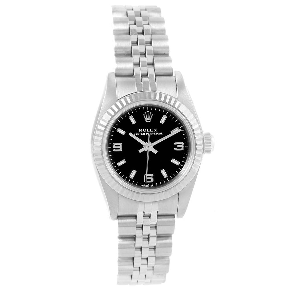 The image shows a front view of a Rolex Oyster Perpetual 76094 Women's Stainless Steel Black Dial 76094 Women's Stainless Steel Black Dial watch with a black dial and a stainless steel bracelet.