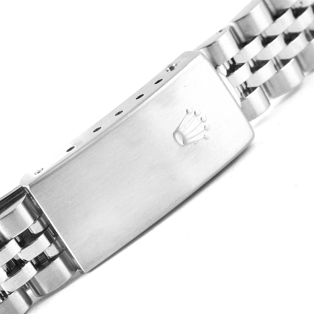 The image shows the clasp and part of the bracelet of a Rolex Oyster Perpetual 76094 Women's Stainless Steel Black Dial 76094 Women's Stainless Steel Black Dial watch.