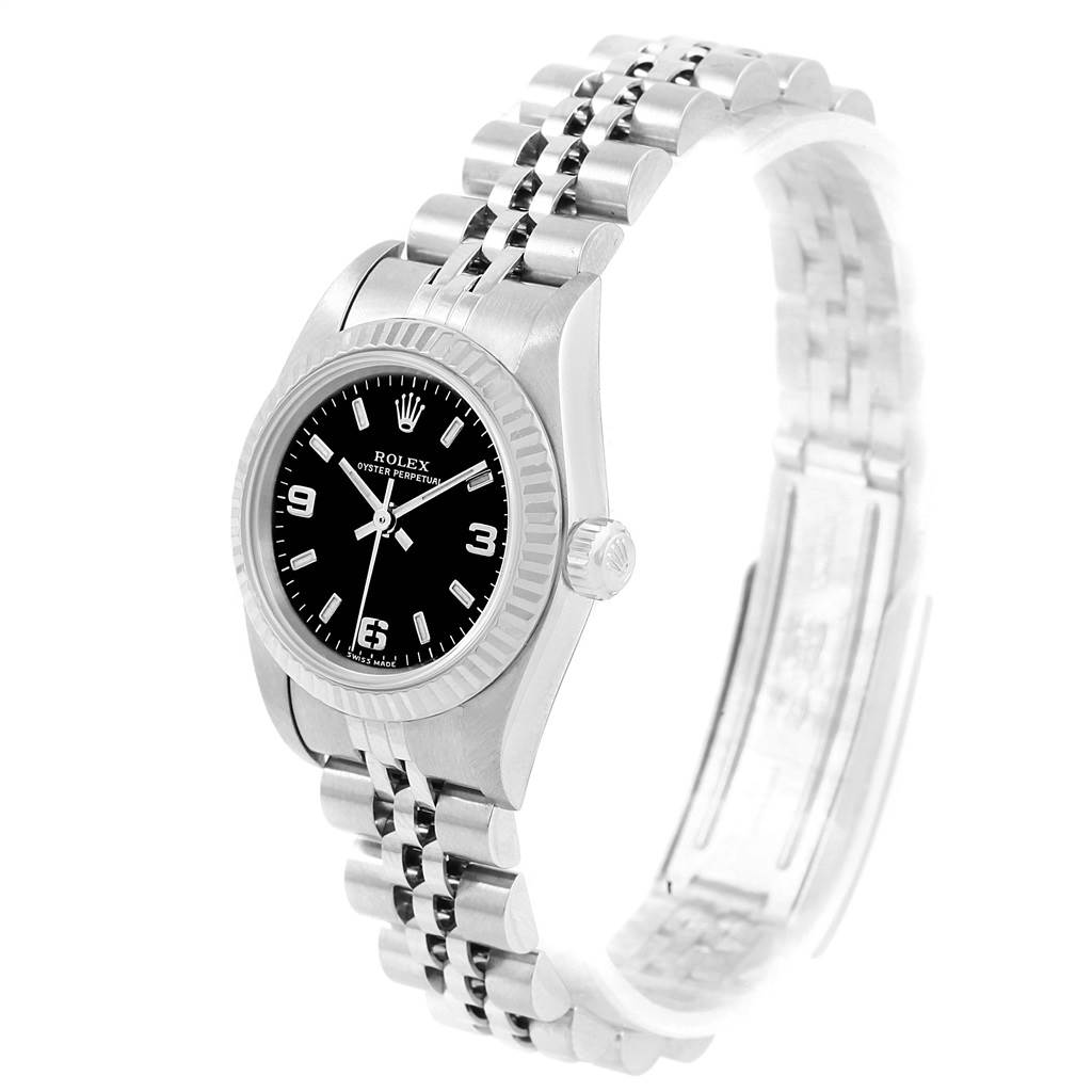 The image shows a side angle view of a Rolex Oyster Perpetual 76094 Women's Stainless Steel Black Dial 76094 Women's Stainless Steel Black Dial watch, highlighting its case, dial, crown, and bracelet.