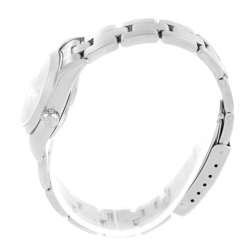 The image shows a side view of the Rolex Oyster Perpetual 76080 Women
s Stainless Steel Pink Dial 76080 Women
s Stainless Steel Pink Dial model, displaying the watch case, crown, and bracelet.