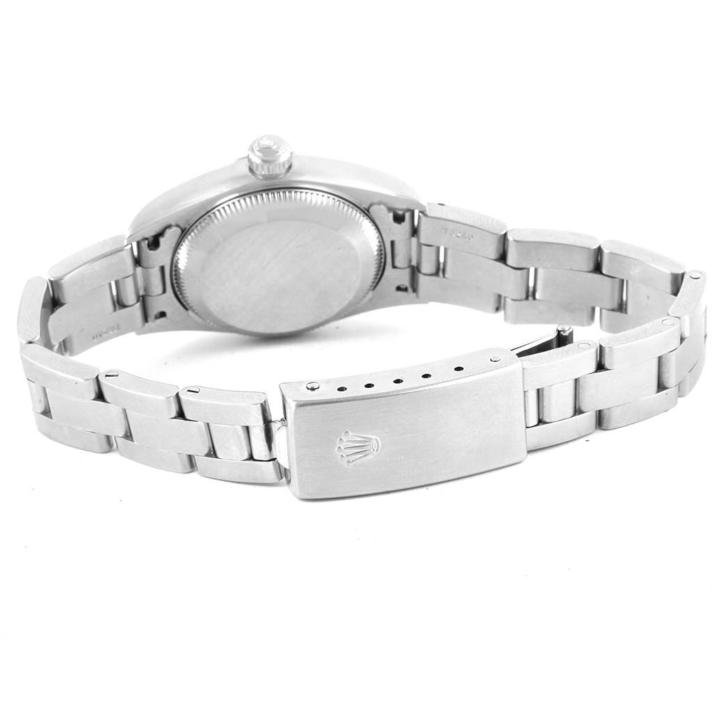 The image shows the back view of a Rolex Oyster Perpetual 76080 Women
s Stainless Steel Pink Dial 76080 Women
s Stainless Steel Pink Dial watch, highlighting its case back and stainless steel bracelet with the clasp open.