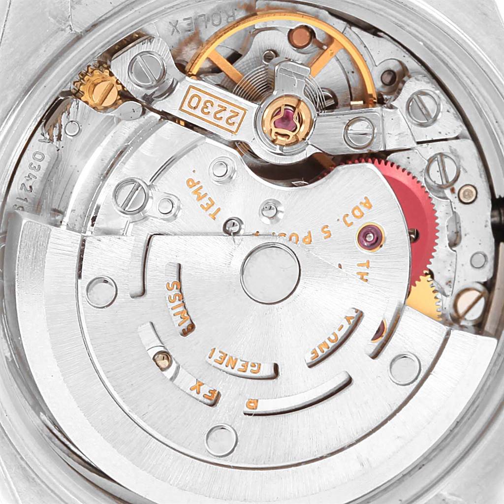 This close-up image shows the intricate internal mechanics of a Rolex Oyster Perpetual 76080 Women
s Stainless Steel Pink Dial 76080 Women
s Stainless Steel Pink Dial watch movement.