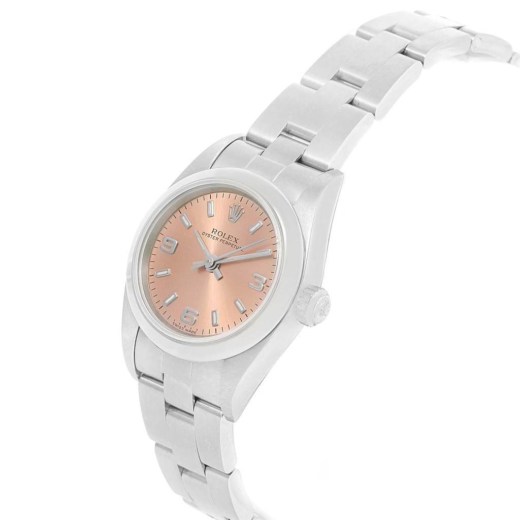 The image shows a Rolex Oyster Perpetual 76080 Women
s Stainless Steel Pink Dial 76080 Women
s Stainless Steel Pink Dial watch at a slight angle, highlighting its pink dial and stainless steel bracelet.