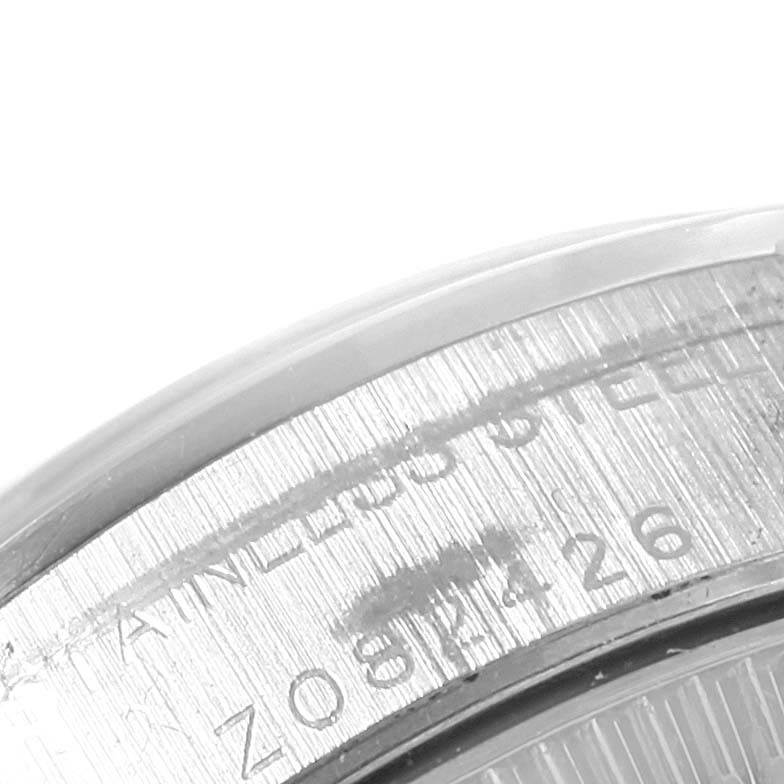 This is a close-up view of the case side showing the serial number of a Rolex Oyster Perpetual 76080 Women
s Stainless Steel Pink Dial 76080 Women
s Stainless Steel Pink Dial watch.