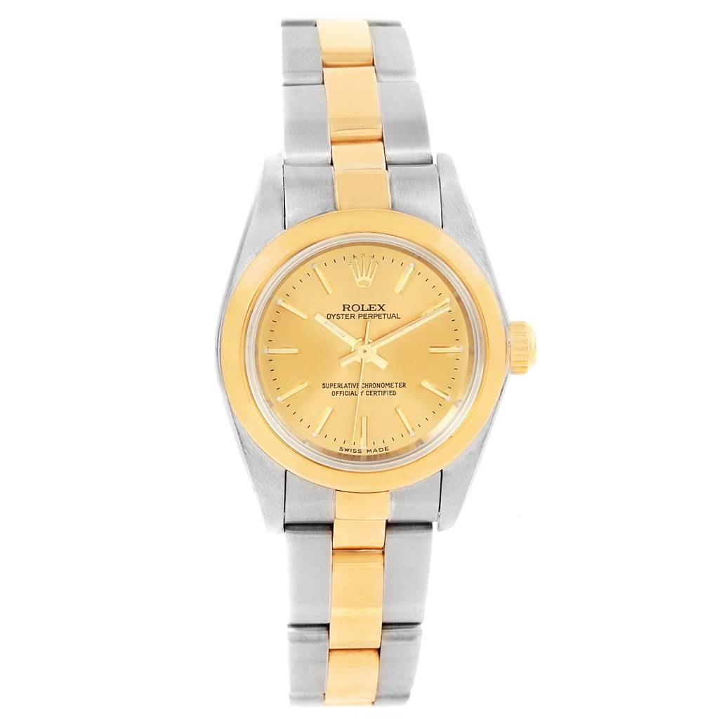 The image shows a front view of the Rolex Oyster Perpetual 76183 Women
s Steel and Gold (two tone) Champagne Dial 76183 Women
s Steel and Gold (two tone) Champagne Dial watch, highlighting its gold and silver design and dial.