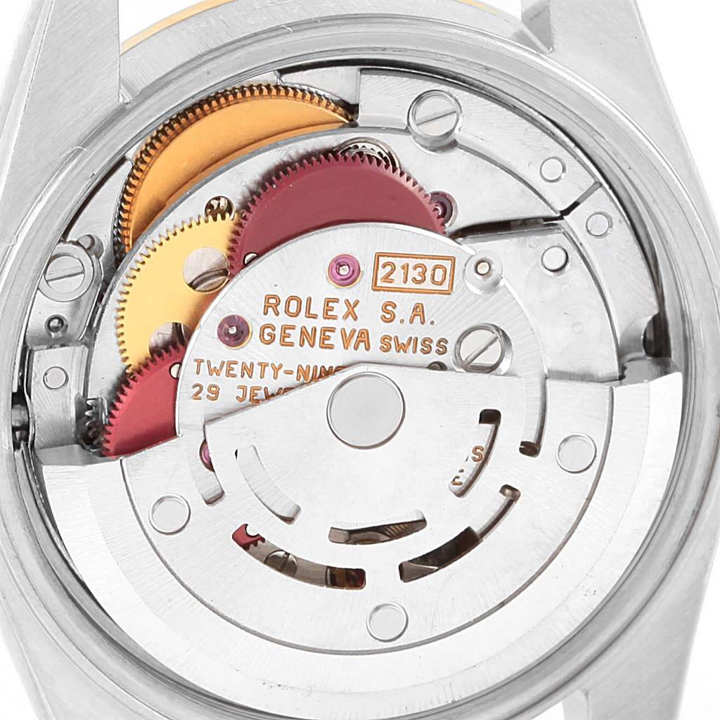 This image shows the internal movement parts of a Rolex Oyster Perpetual 67193 Women's Steel and Gold (two tone) Black Dial 67193 Women's Steel and Gold (two tone) Black Dial watch from a close-up angle.