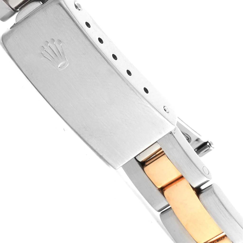 This image shows the clasp and part of the bracelet of a Rolex Oyster Perpetual 67193 Women's Steel and Gold (two tone) Black Dial 67193 Women's Steel and Gold (two tone) Black Dial watch.
