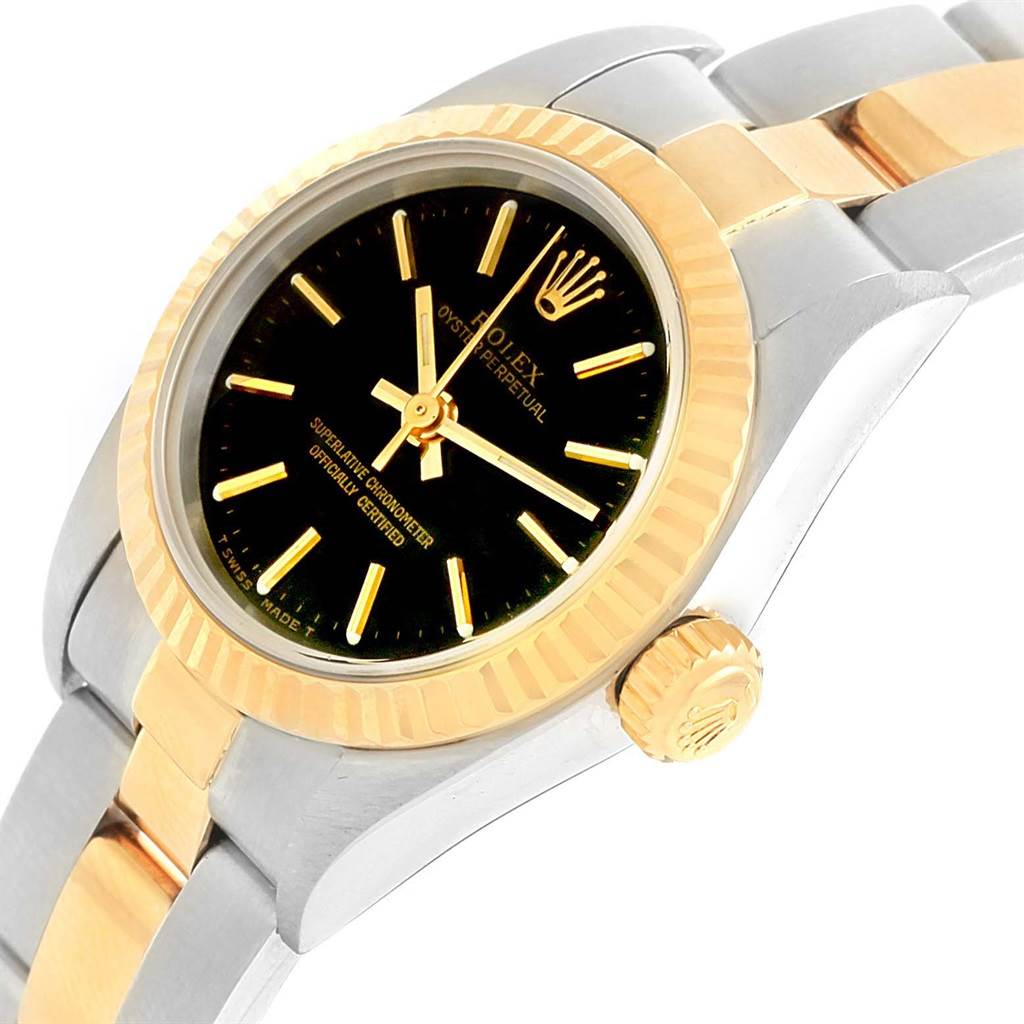 The image shows a Rolex Oyster Perpetual 67193 Women's Steel and Gold (two tone) Black Dial 67193 Women's Steel and Gold (two tone) Black Dial watch at an angled side view, highlighting the dial, bezel, crown, and part of the bracelet.