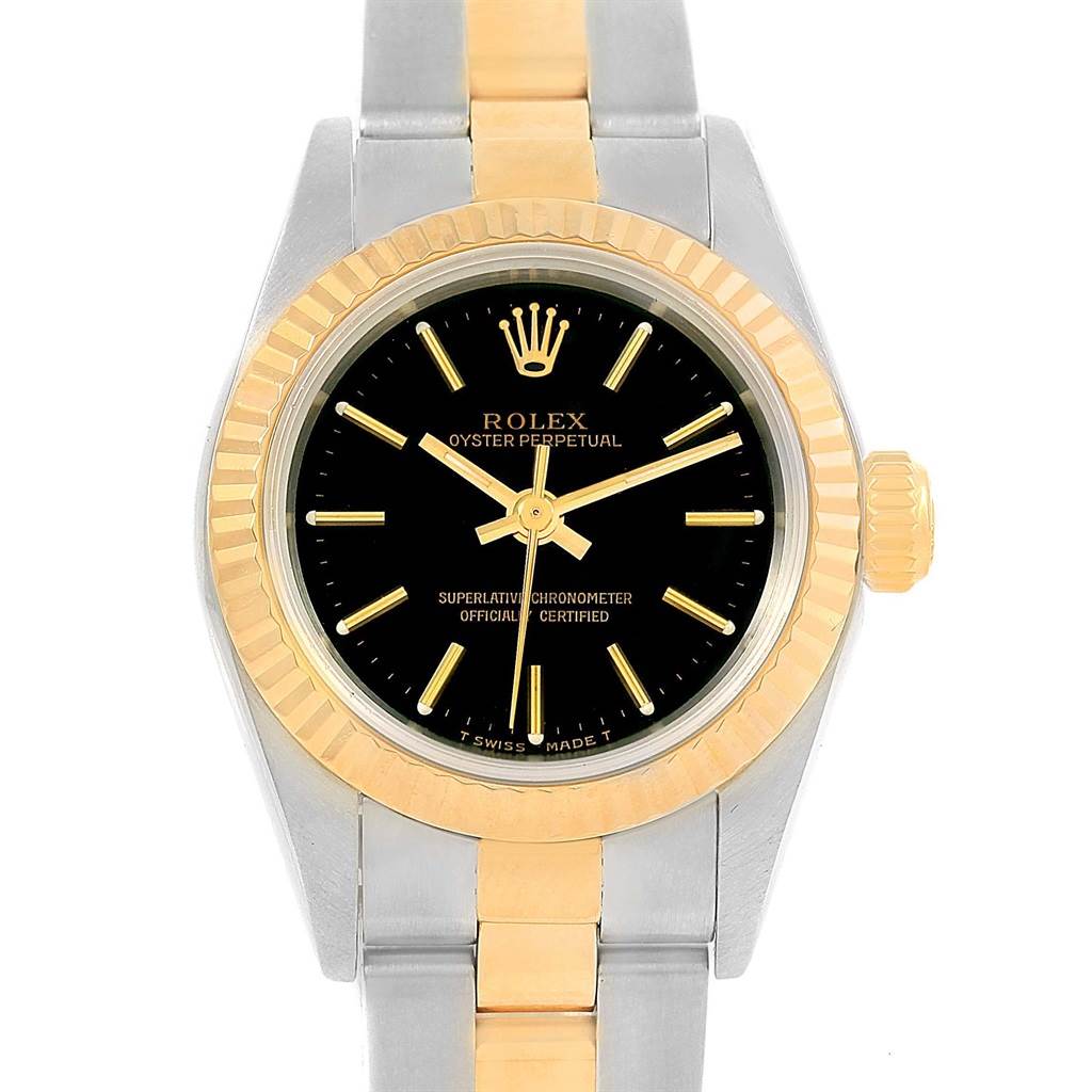 The image shows a front view of a Rolex Oyster Perpetual 67193 Women's Steel and Gold (two tone) Black Dial 67193 Women's Steel and Gold (two tone) Black Dial watch, highlighting its dial, bezel, and partially the bracelet.