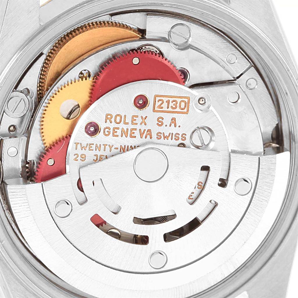 The image shows the inner mechanism and movement of the Rolex Oyster Perpetual 67193 Women's Steel and Gold (two tone) Champagne Dial 67193 Women's Steel and Gold (two tone) Champagne Dial model from a close-up angle.