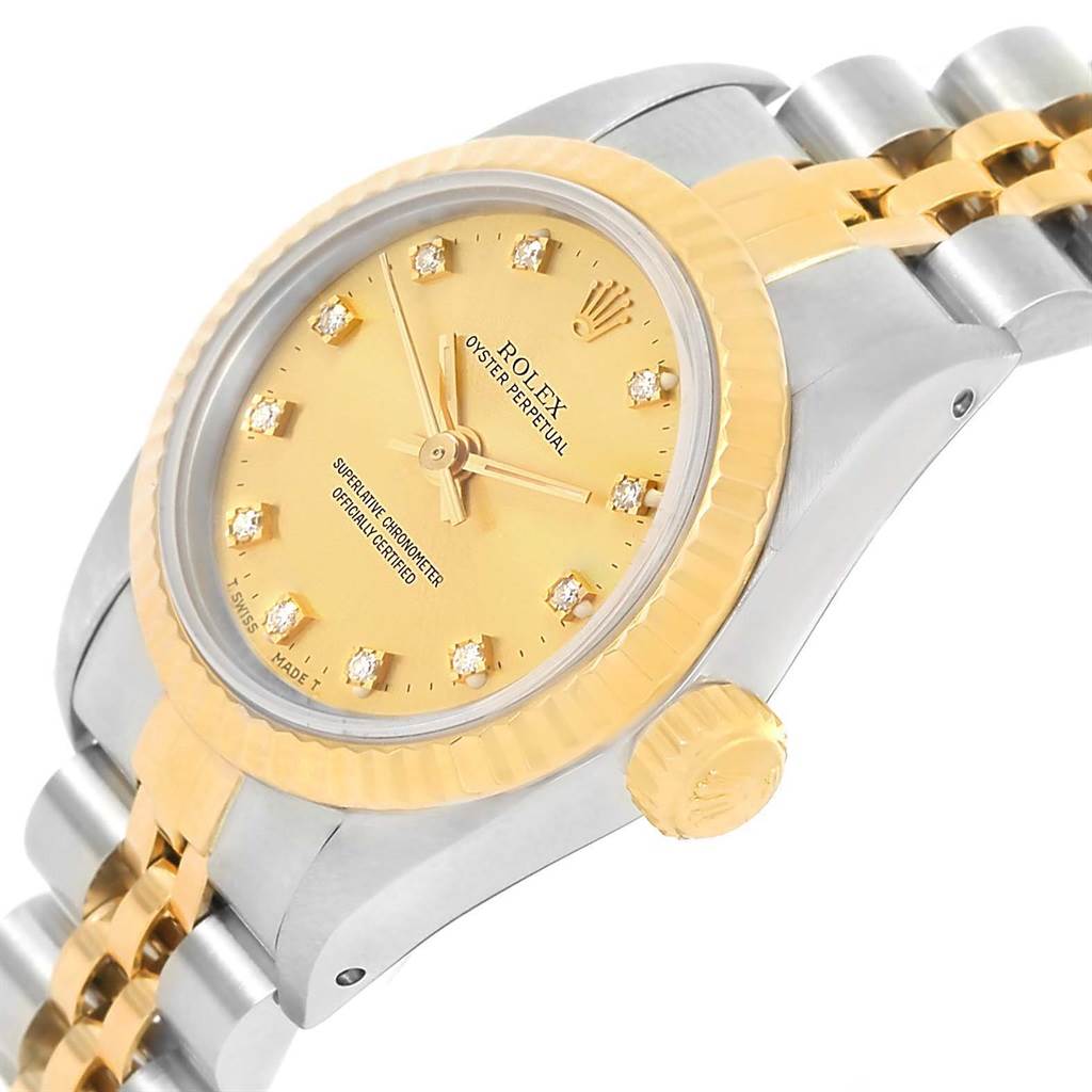 The image shows a Rolex Oyster Perpetual 67193 Women's Steel and Gold (two tone) Champagne Dial 67193 Women's Steel and Gold (two tone) Champagne Dial watch at an angle showcasing the dial, bezel, crown, and part of the bracelet.