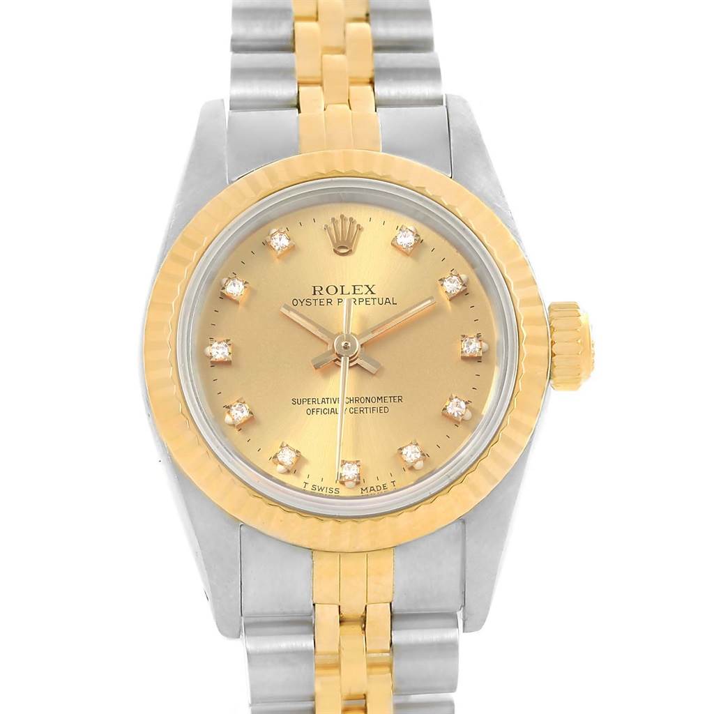 The Rolex Oyster Perpetual 67193 Women's Steel and Gold (two tone) Champagne Dial 67193 Women's Steel and Gold (two tone) Champagne Dial watch is shown from a front angle, displaying the dial, bezel, and bracelet.