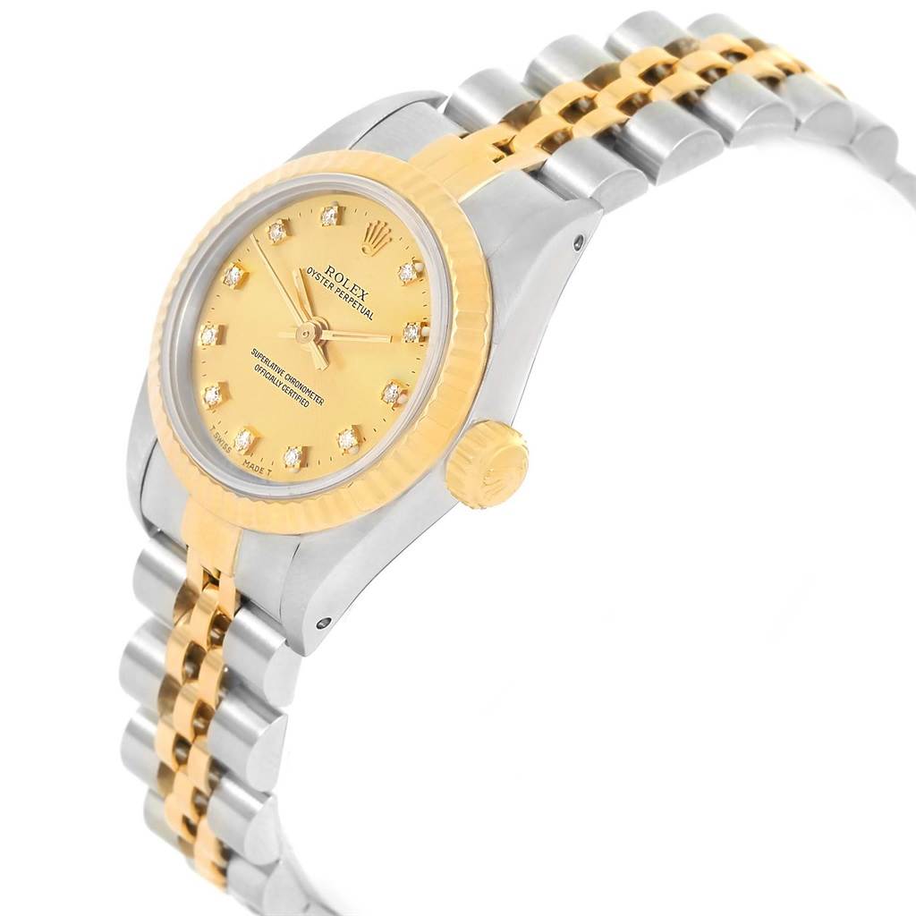 The image shows a side-angle view of a Rolex Oyster Perpetual 67193 Women's Steel and Gold (two tone) Champagne Dial 67193 Women's Steel and Gold (two tone) Champagne Dial watch, highlighting the dial, bezel, crown, and bracelet.
