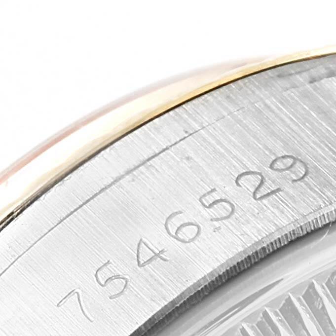 This image shows a close-up of the serial number on the bezel of a Rolex Oyster Perpetual 6917 Women's Stainless Steel Champagne Dial 6917 Women's Stainless Steel Champagne Dial watch.