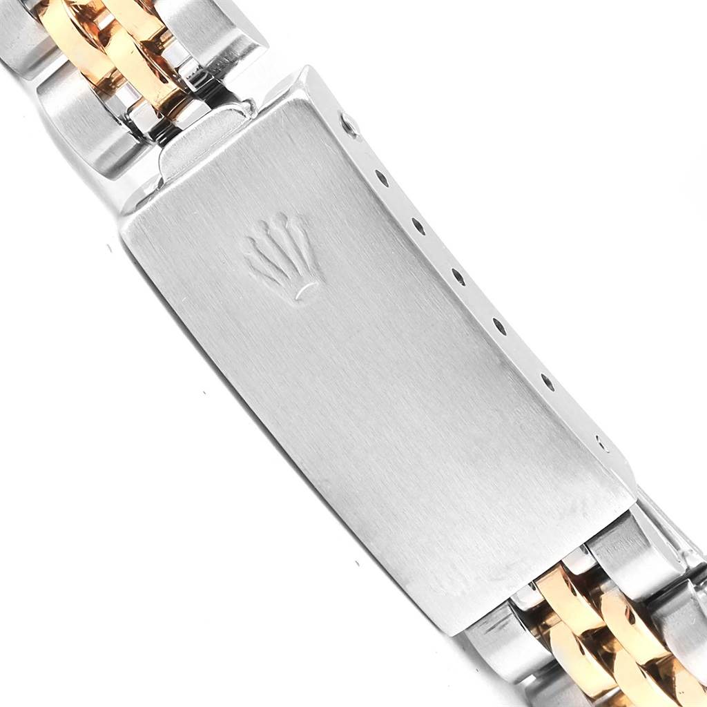The image shows the clasp and part of the bracelet of a Rolex Oyster Perpetual 6917 Women's Stainless Steel Champagne Dial 6917 Women's Stainless Steel Champagne Dial watch, highlighting the brand's logo.
