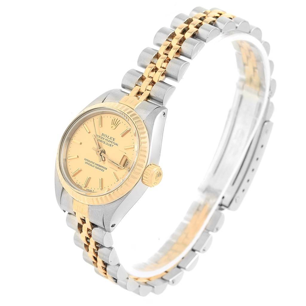 The image shows a Rolex Oyster Perpetual 6917 Women's Stainless Steel Champagne Dial 6917 Women's Stainless Steel Champagne Dial watch from a slight side angle, highlighting the dial, bezel, crown, and two-tone bracelet.