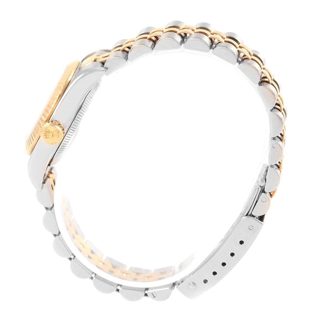 The image shows a side profile of the Rolex Oyster Perpetual 67193 Women's Steel and Gold (two tone) Black Dial 67193 Women's Steel and Gold (two tone) Black Dial watch, highlighting the band and crown.