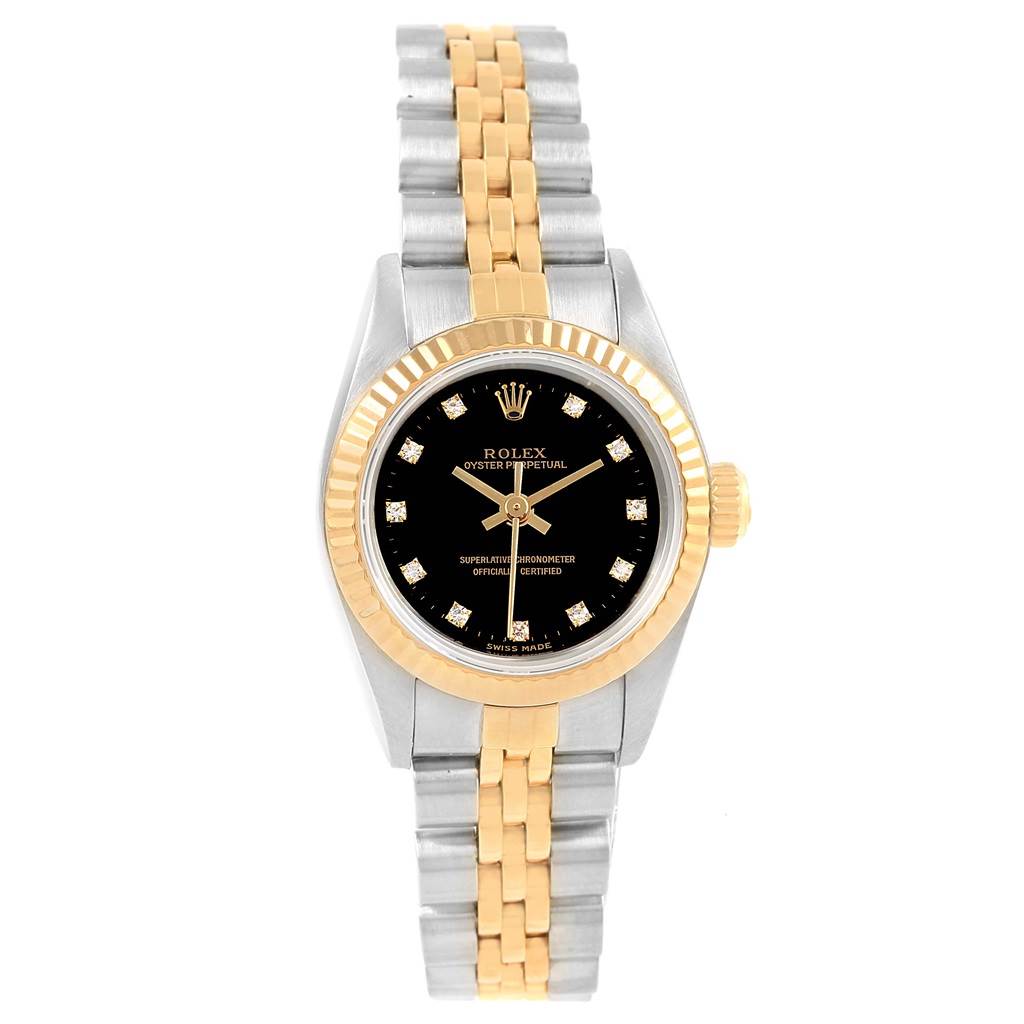 The image shows a front view of a Rolex Oyster Perpetual 67193 Women's Steel and Gold (two tone) Black Dial 67193 Women's Steel and Gold (two tone) Black Dial watch, highlighting its black dial, gold and silver case, and two-tone bracelet.