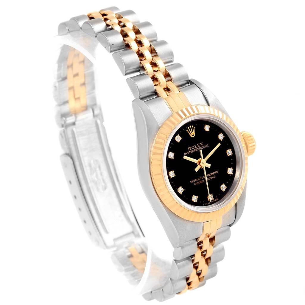 The Rolex Oyster Perpetual 67193 Women's Steel and Gold (two tone) Black Dial 67193 Women's Steel and Gold (two tone) Black Dial watch is shown at an angle highlighting the dial, bezel, and the two-tone bracelet.