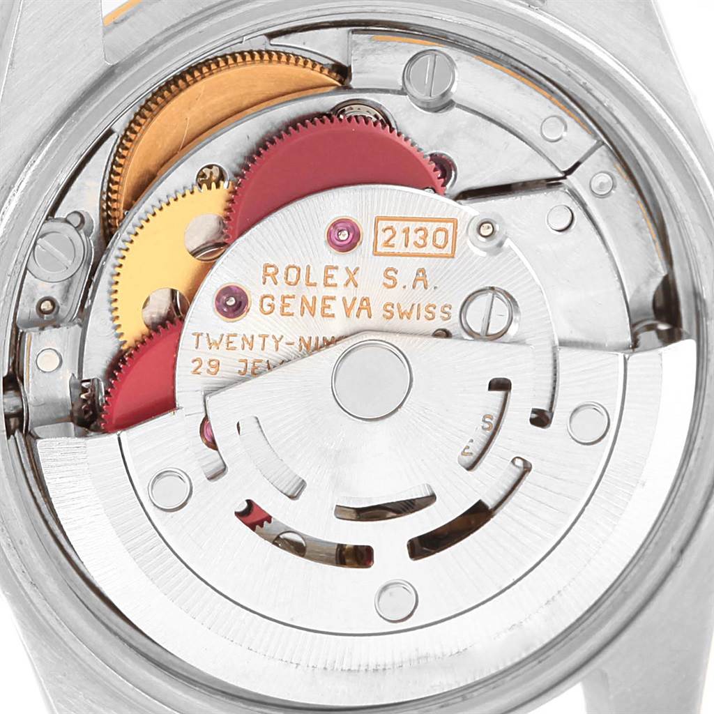 This image shows the movement mechanism of a Rolex Oyster Perpetual 67193 Women's Steel and Gold (two tone) Black Dial 67193 Women's Steel and Gold (two tone) Black Dial watch from a top-down angle.