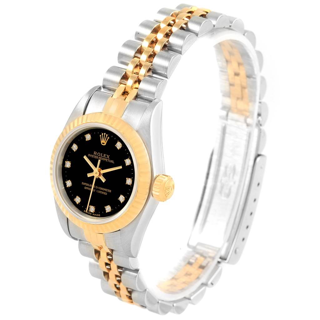 The image shows a Rolex Oyster Perpetual 67193 Women's Steel and Gold (two tone) Black Dial 67193 Women's Steel and Gold (two tone) Black Dial watch from a slight side angle, highlighting its two-tone bracelet and black dial with diamond markers.