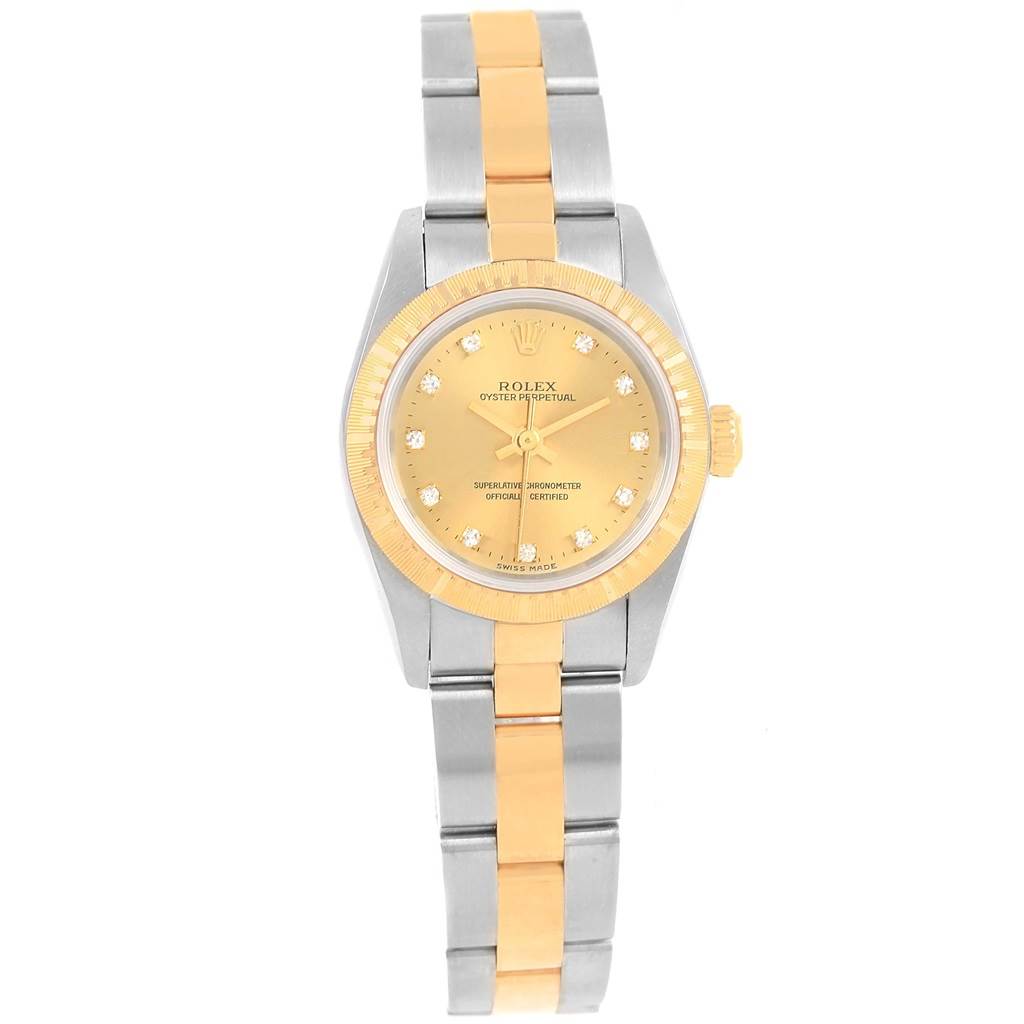 This Rolex Oyster Perpetual 76243 Women's Steel and Gold (two tone) Champagne Dial 76243 Women's Steel and Gold (two tone) Champagne Dial watch is shown directly from the front, highlighting the face, bezel, and bracelet.