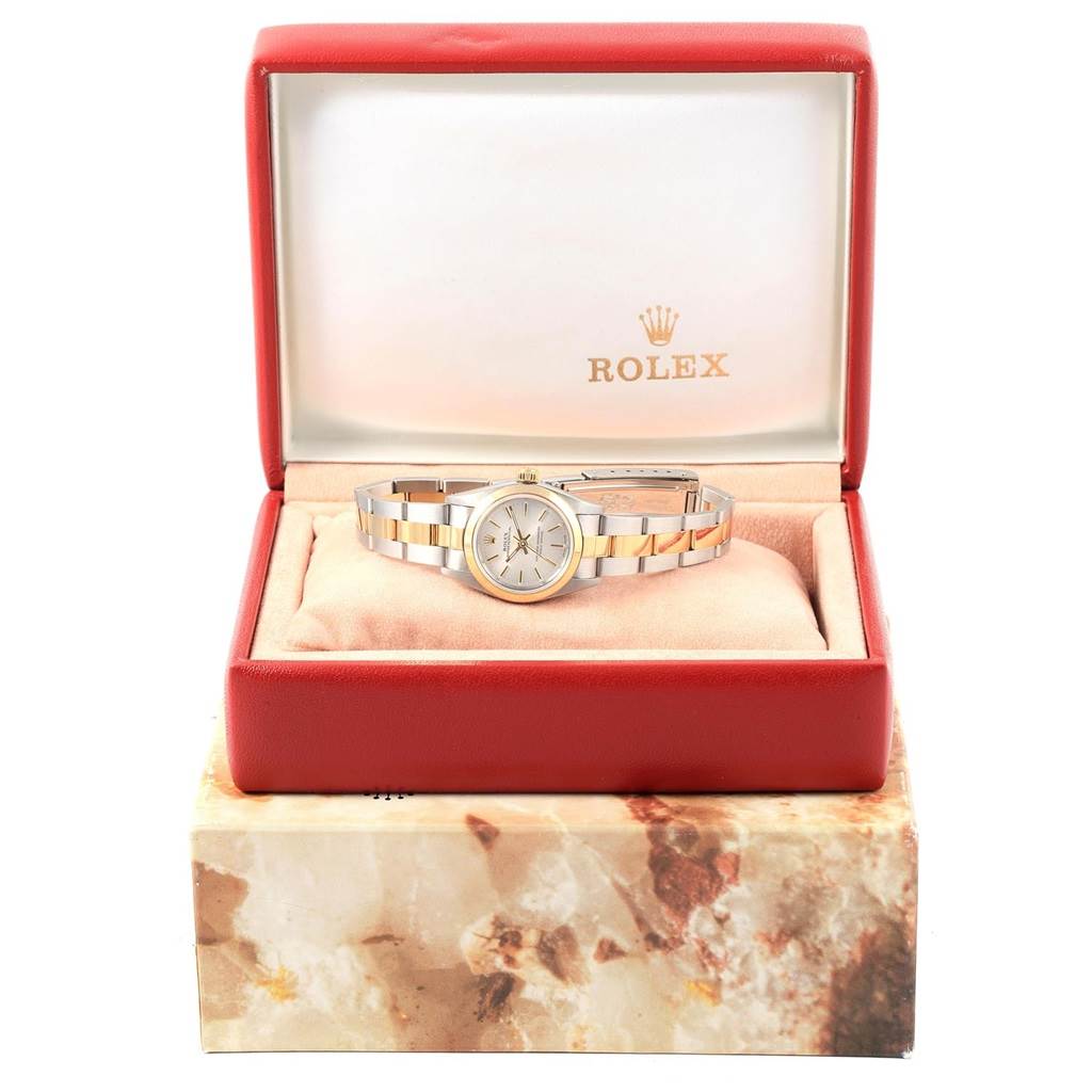 The Rolex Oyster Perpetual 76183 Women's Steel and Gold (two tone) Silver Dial 76183 Women's Steel and Gold (two tone) Silver Dial watch is displayed in its red box, showing the face and bracelet from the front angle.