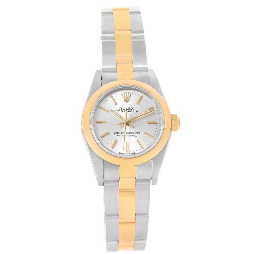 The Rolex Oyster Perpetual 76183 Women's Steel and Gold (two tone) Silver Dial 76183 Women's Steel and Gold (two tone) Silver Dial watch is shown from a top-down angle, displaying its face, bezel, and two-tone metal bracelet.