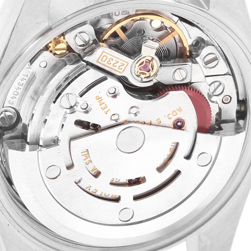 This image shows a close-up view of the movement mechanism of a Rolex Oyster Perpetual 76183 Women's Steel and Gold (two tone) Silver Dial 76183 Women's Steel and Gold (two tone) Silver Dial watch.