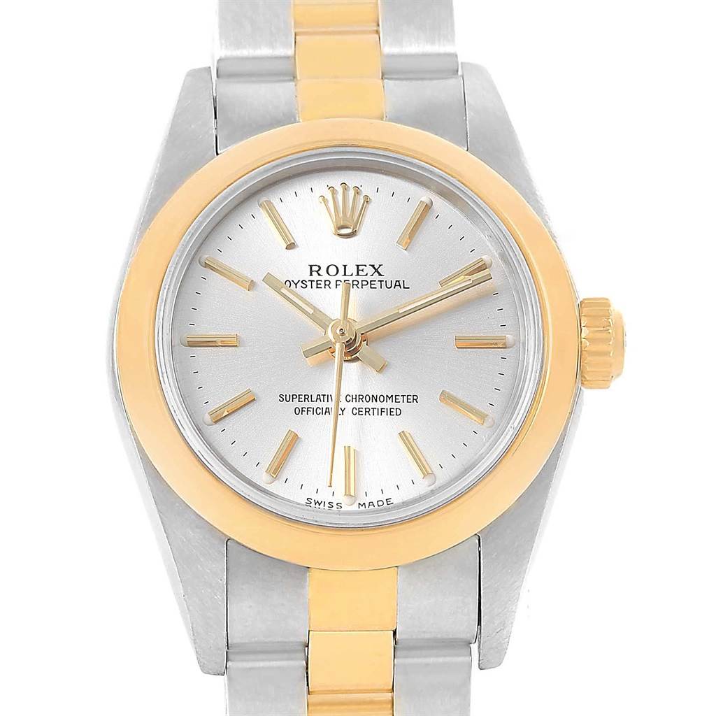 The image shows a top-down view of a Rolex Oyster Perpetual 76183 Women's Steel and Gold (two tone) Silver Dial 76183 Women's Steel and Gold (two tone) Silver Dial watch, highlighting its dial, bezel, and part of the bracelet.