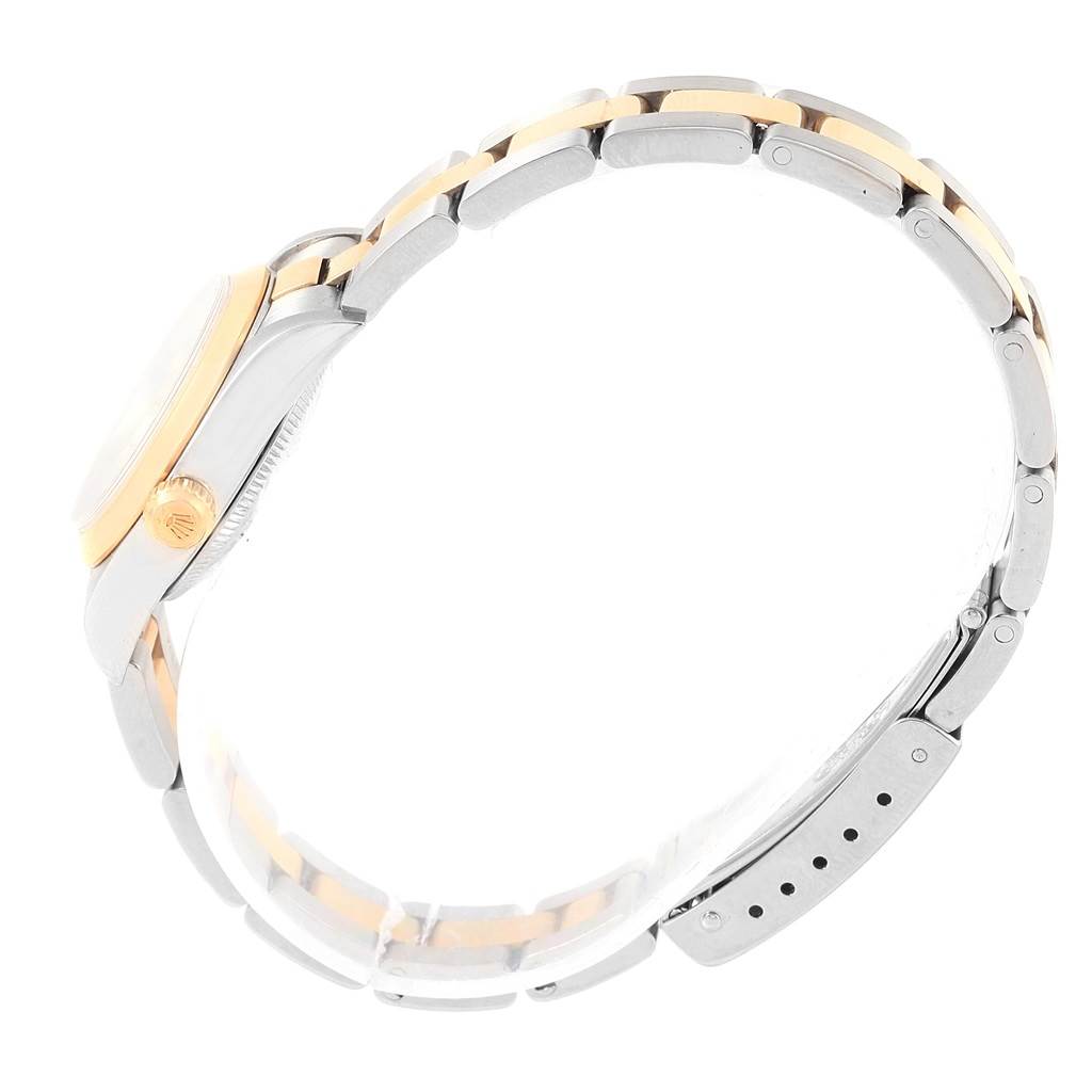 The image shows a side view of a Rolex Oyster Perpetual 76183 Women's Steel and Gold (two tone) Silver Dial 76183 Women's Steel and Gold (two tone) Silver Dial watch, highlighting its two-tone bracelet and the crown.