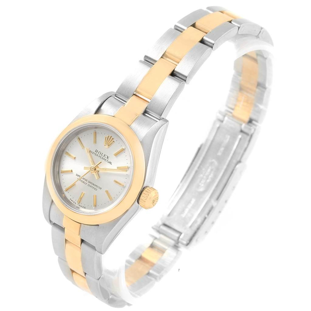 The image shows a side and top view of a Rolex Oyster Perpetual 76183 Women's Steel and Gold (two tone) Silver Dial 76183 Women's Steel and Gold (two tone) Silver Dial watch, highlighting its gold and silver bracelet and bezel.