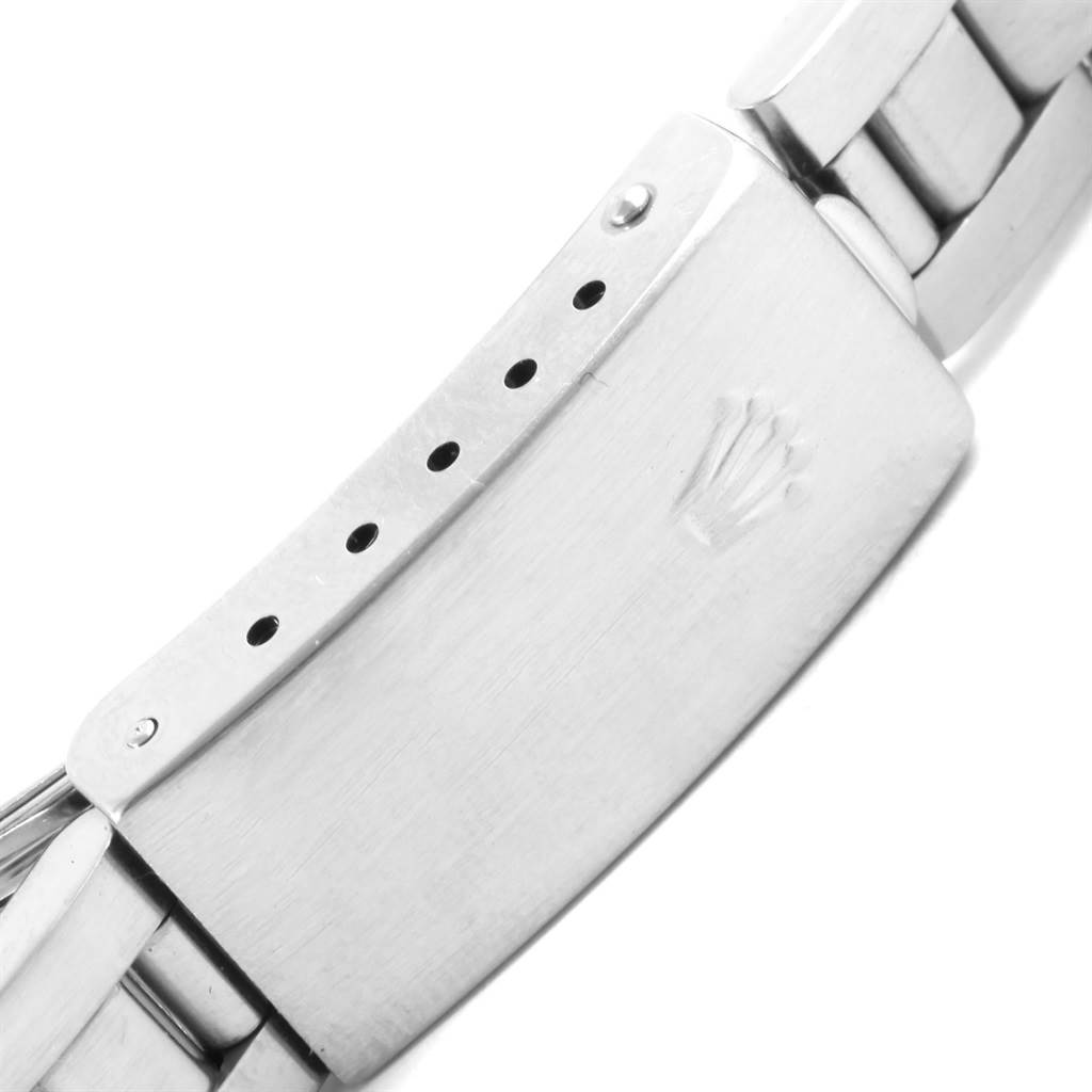 The image shows the clasp and part of the bracelet of a Rolex Oyster Perpetual 76080 Women's Stainless Steel Blue Dial 76080 Women's Stainless Steel Blue Dial watch.