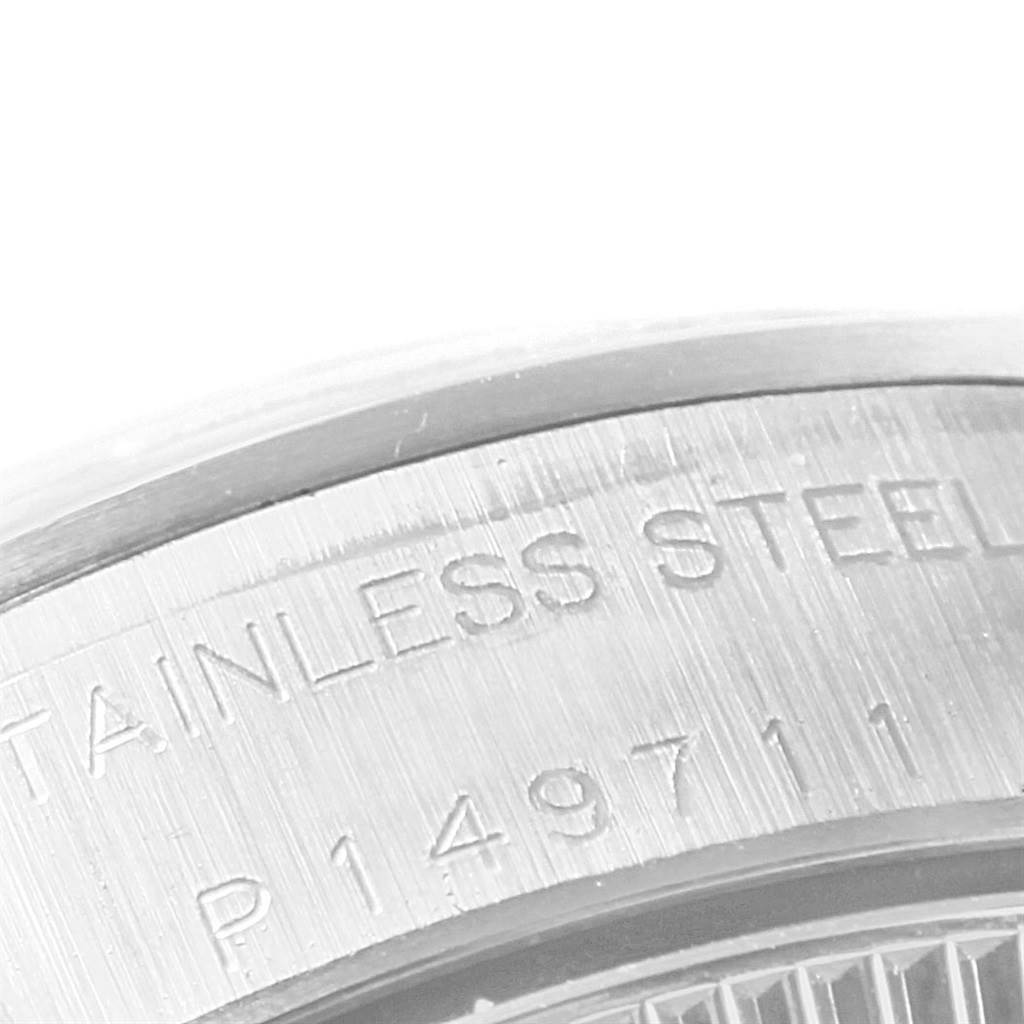 The close-up image shows the stainless steel casing of an Oyster Perpetual Rolex watch.