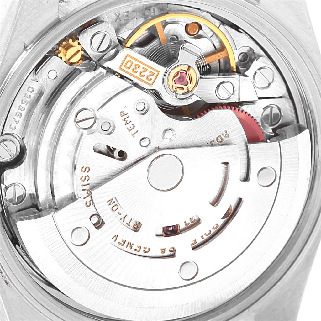 This image displays the internal mechanism of the Rolex Oyster Perpetual 76080 Women's Stainless Steel Blue Dial 76080 Women's Stainless Steel Blue Dial watch, focusing on the movement and rotor.