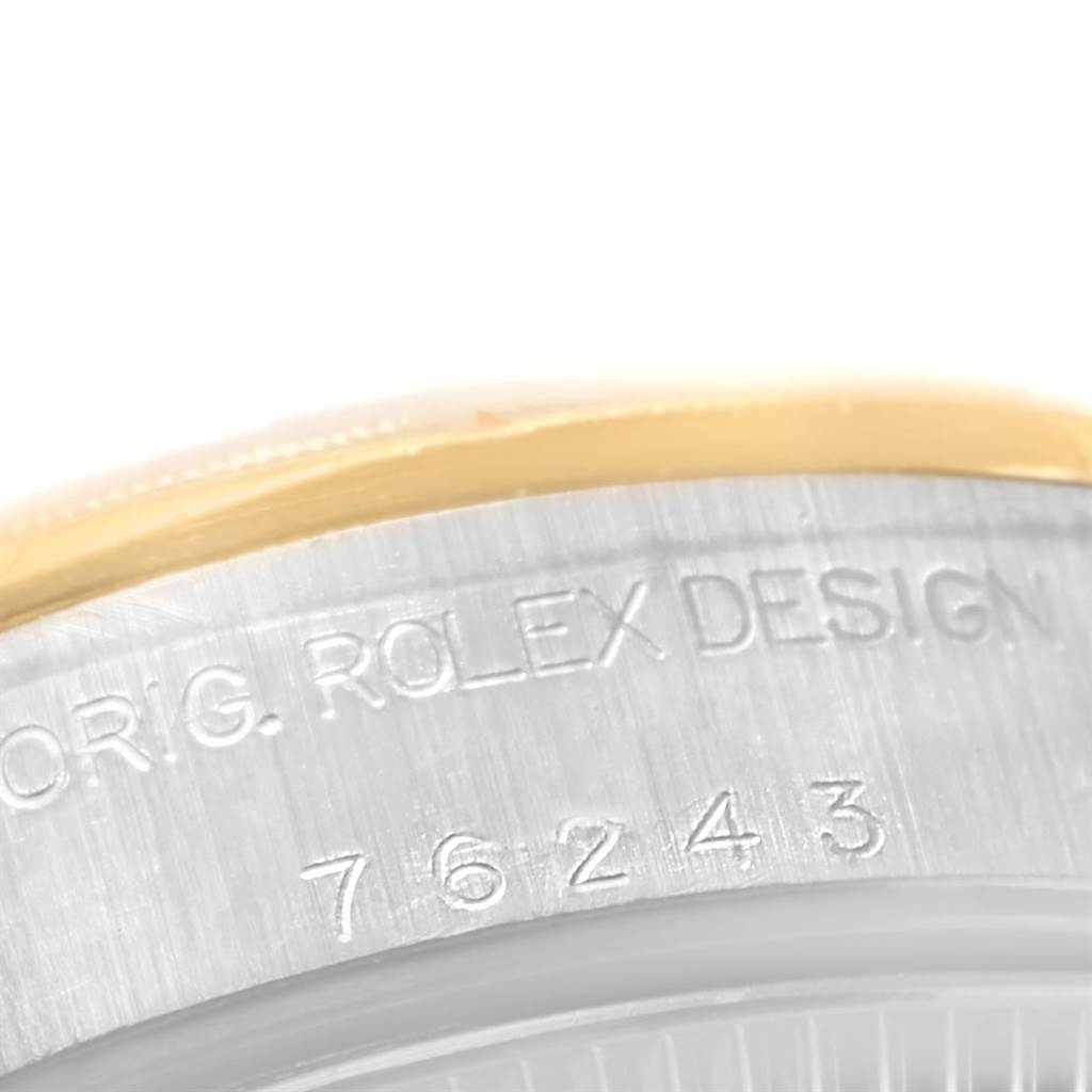 This image shows a close-up of the case back engravings on a Rolex Oyster Perpetual 76243 Women's Steel and Gold (two tone) Champagne Dial 76243 Women's Steel and Gold (two tone) Champagne Dial watch.