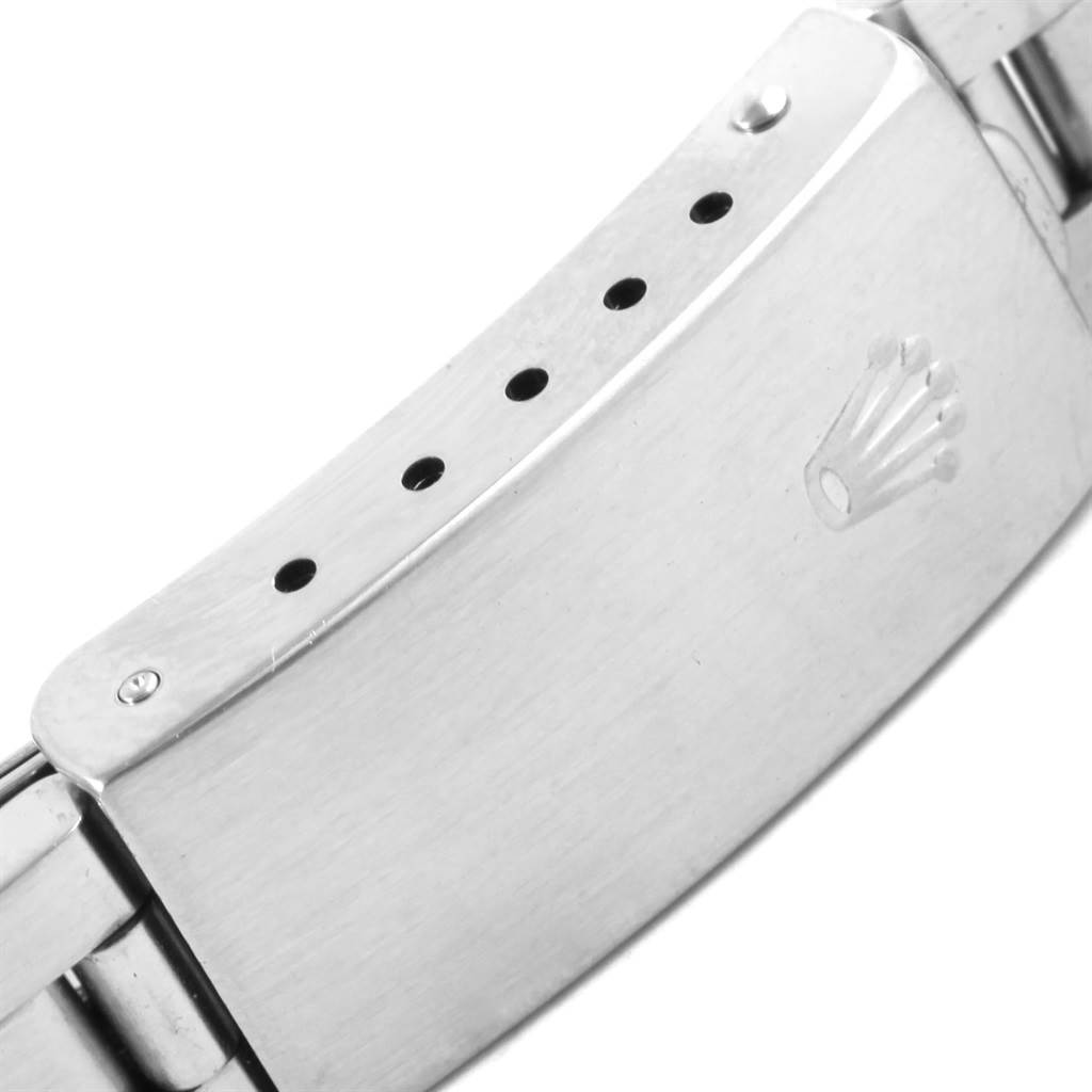 This image shows a close-up of the clasp on the band of a Rolex Oyster Perpetual 67194 Women's Stainless Steel Pink Dial 67194 Women's Stainless Steel Pink Dial watch.