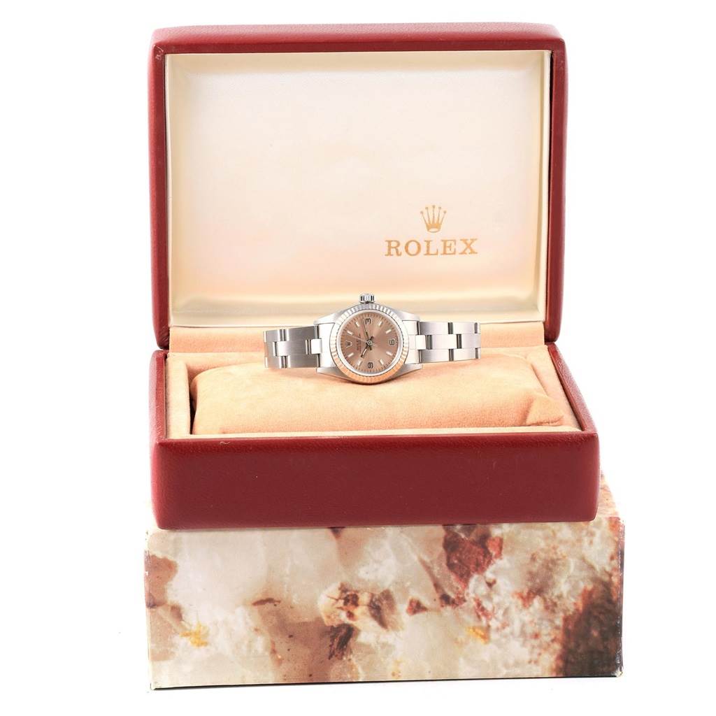 The Rolex Oyster Perpetual 67194 Women's Stainless Steel Pink Dial 67194 Women's Stainless Steel Pink Dial watch is shown front-facing inside its branded box.