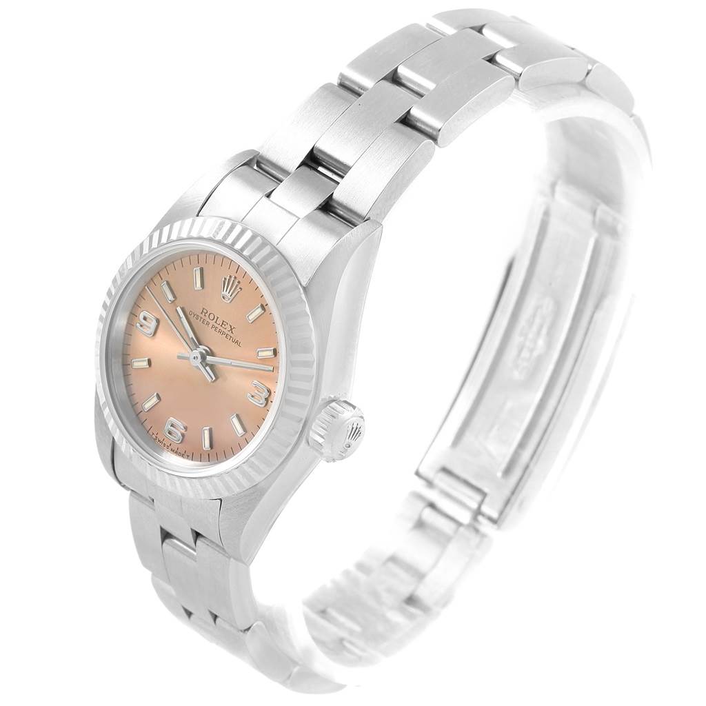 This image shows a Rolex Oyster Perpetual 67194 Women's Stainless Steel Pink Dial 67194 Women's Stainless Steel Pink Dial watch from a three-quarter angle, highlighting its bracelet, crown, and dial.