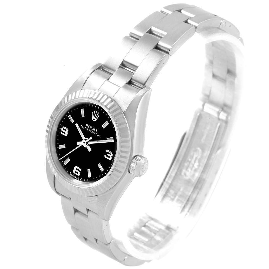 The image shows a Rolex Oyster Perpetual 76094 Women's Stainless Steel Black Dial 76094 Women's Stainless Steel Black Dial watch at a three-quarter front angle, highlighting the face, bezel, and bracelet.