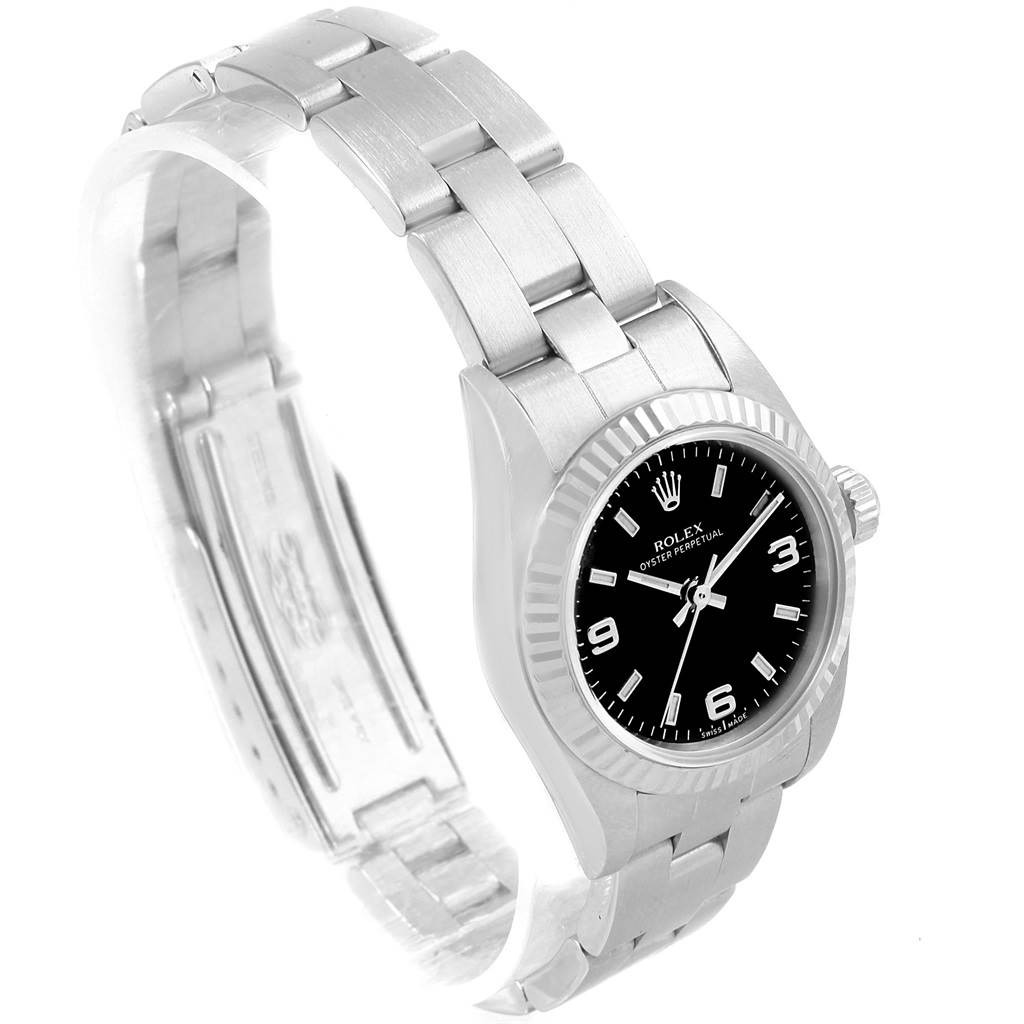 The image shows a side angle of a Rolex Oyster Perpetual 76094 Women's Stainless Steel Black Dial 76094 Women's Stainless Steel Black Dial watch, displaying the bracelet, clasp, case, and dial.