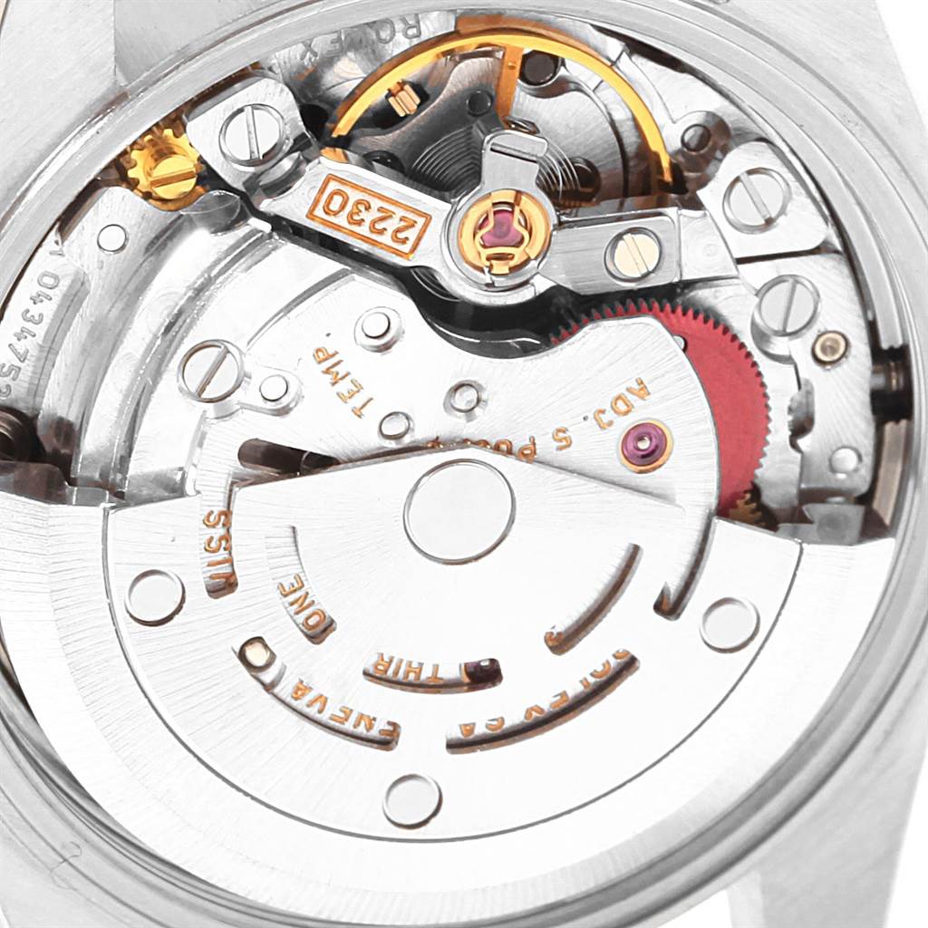 This image shows a close-up view of the movement mechanism inside a Rolex Oyster Perpetual 76094 Women's Stainless Steel Black Dial 76094 Women's Stainless Steel Black Dial watch model.