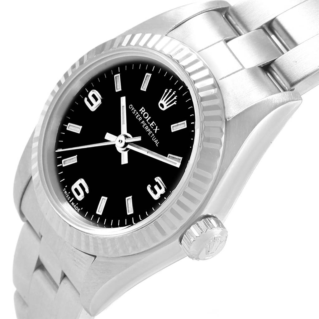 This image shows a close-up angle of the Rolex Oyster Perpetual 76094 Women's Stainless Steel Black Dial 76094 Women's Stainless Steel Black Dial watch, highlighting the dial, bezel, crown, and part of the bracelet.