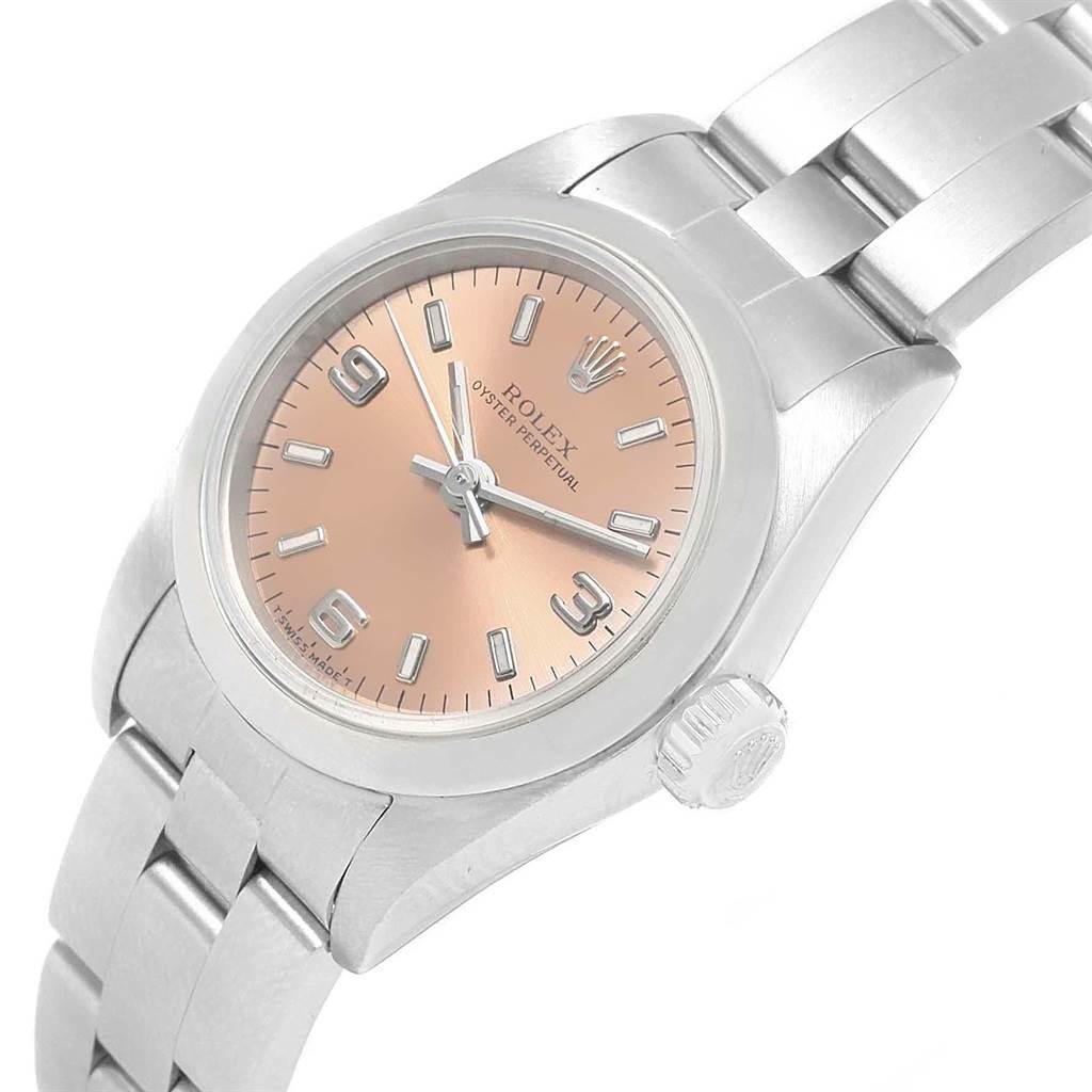 This image shows a Rolex Oyster Perpetual 67180 Women
s Stainless Steel Pink Dial 67180 Women
s Stainless Steel Pink Dial watch at an angle highlighting the dial, bracelet, and crown.