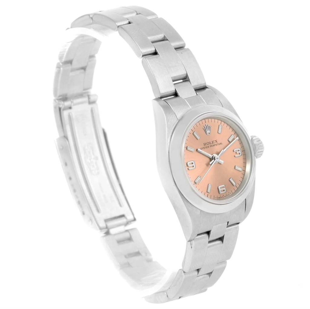 The image shows a Rolex Oyster Perpetual 67180 Women
s Stainless Steel Pink Dial 67180 Women
s Stainless Steel Pink Dial watch at a slight angle, showcasing the bracelet, dial, and case.