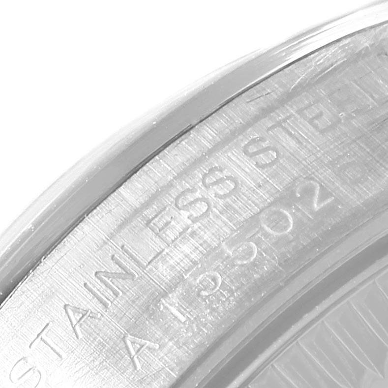 This close-up image shows the engraved text on the stainless steel back of the Rolex Oyster Perpetual 67180 Women
s Stainless Steel Pink Dial 67180 Women
s Stainless Steel Pink Dial watch.