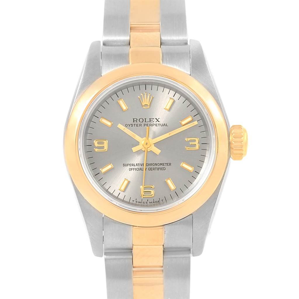 The image shows a frontal view of the Rolex Oyster Perpetual 67183 Women's Steel and Gold (two tone) Grey Dial 67183 Women's Steel and Gold (two tone) Grey Dial watch, highlighting its face, bezel, and part of the bracelet.