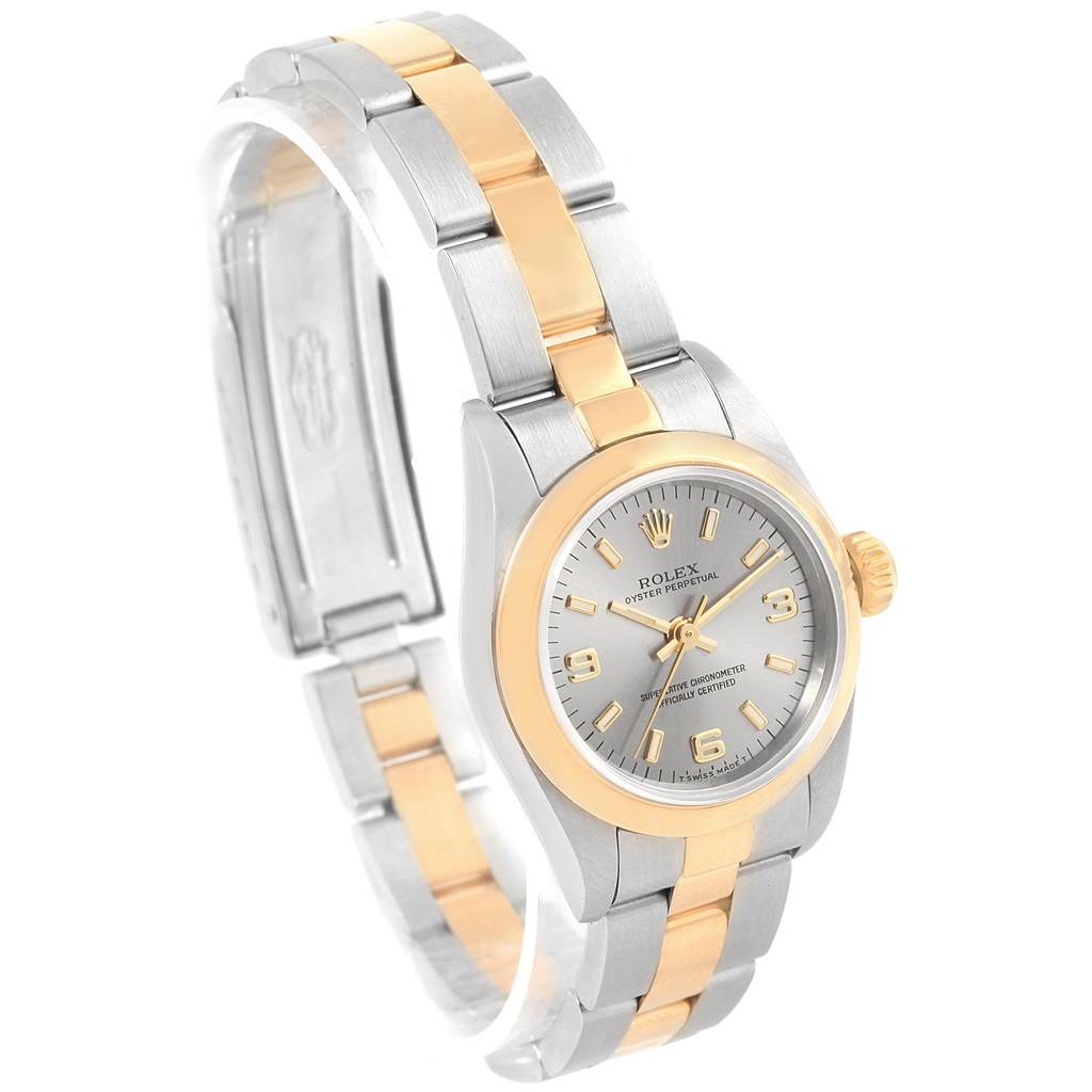 The image shows a Rolex Oyster Perpetual 67183 Women's Steel and Gold (two tone) Grey Dial 67183 Women's Steel and Gold (two tone) Grey Dial watch at a slight angle, highlighting its two-tone band and silver dial.