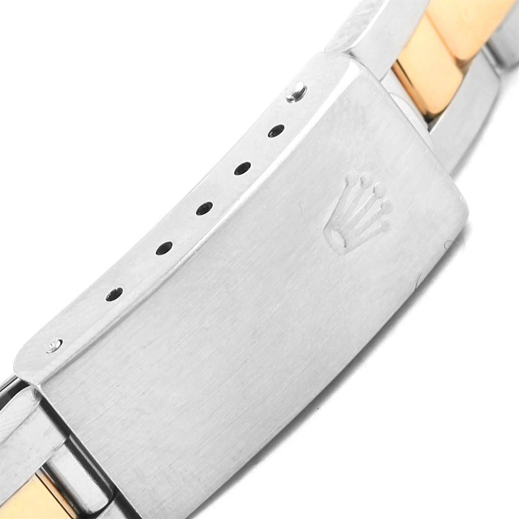 The image shows a close-up of the clasp of a Rolex Oyster Perpetual 67183 Women's Steel and Gold (two tone) Grey Dial 67183 Women's Steel and Gold (two tone) Grey Dial watch, featuring the Rolex crown logo.