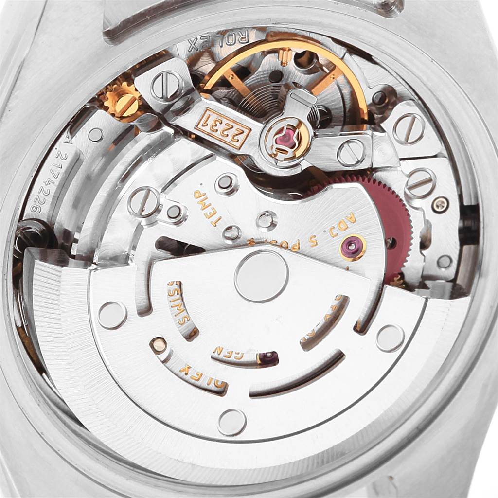 This is a close-up view of the internal mechanism of a Rolex Oyster Perpetual 176200 Women's Stainless Steel Black Dial 176200 Women's Stainless Steel Black Dial watch, showcasing its intricate parts and movement.